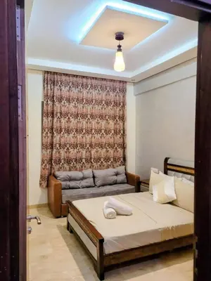 a bedroom with a bed and a couch at Moroccan Sunset - Charming 3BR near Airport Med 5 in Nouaseur