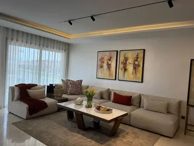 a living room with a couch and a table at Rabat Atlantic Océan in Rabat