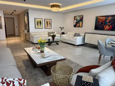 a living room with couches and a table at Rabat Atlantic Océan in Rabat