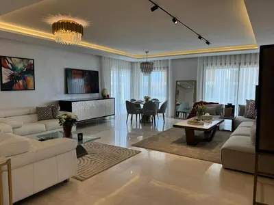a living room with a couch and a table at Rabat Atlantic Océan in Rabat