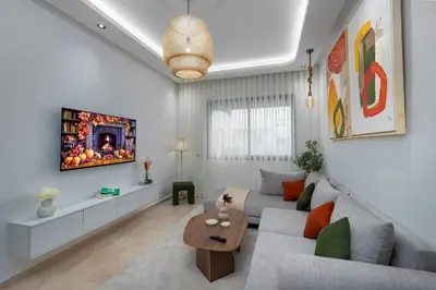 a living room with a couch and a table at Luxury Studio Apartment - Maarif Near CFC & Downtown in Casablanca