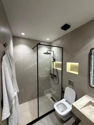 a bathroom with a shower and a toilet at Apartment in Rabat Ocean Absolute Refinement in Rabat