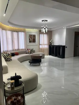 a large living room with a couch and a table at Appartamento di lusso nel cuore di Rabat in Rabat