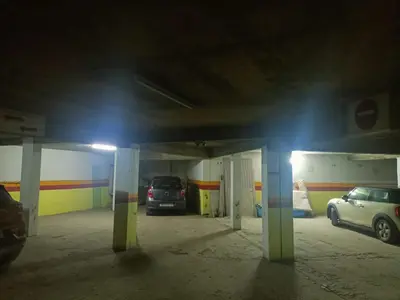 a parking garage with two cars parked in it at Appartamento di lusso nel cuore di Rabat in Rabat