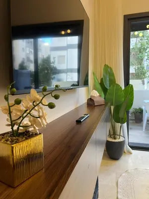 a living room with a wooden counter with a window at A Suites in Casablanca