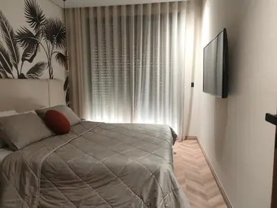 a bedroom with a bed in front of a window at Studio haut standing in Casablanca