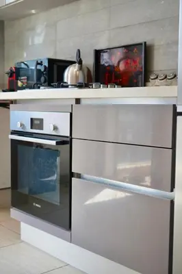 a kitchen with an oven and a counter top at Casablanca Finance City 2Bdr in Casablanca