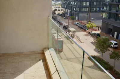 a balcony of a building with a view of a street at Casablanca Finance City 2Bdr in Casablanca