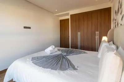a bedroom with a bed with an umbrella on it at Modern Studio in Maarif 16 with Free Private Parking in Casablanca