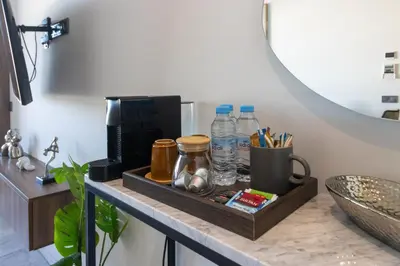 a table with bottles of water and a mirror at Modern Studio in Maarif 16 with Free Private Parking in Casablanca