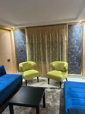 a living room with a couch and two chairs at Beautiful apartment in Hay Al Qods Bernoussi in Casablanca