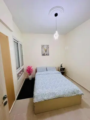 a bedroom with a bed and a window at Elegant house for you in Ain Sebaa 4 in Casablanca