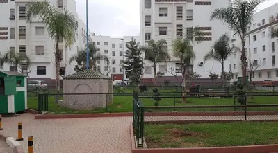a park with a statue in the middle of a city at Elegant house for you in Ain Sebaa 4 in Casablanca
