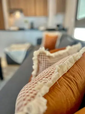 a close up of a couch in a living room at Charming Studio in Zenata Eco-city, Pool and Sea View in Aïn Harrouda