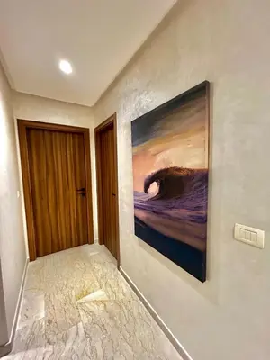 a painting hanging on a wall in a room at Luxury Studio in a secured residence in Aïn Harrouda
