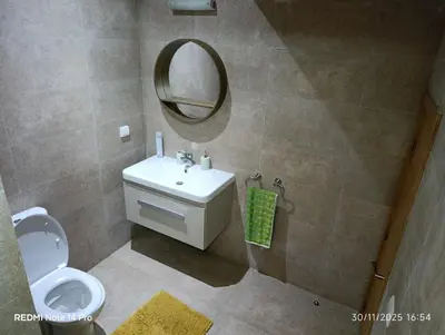 a bathroom with a toilet and a sink and a mirror at Océane palm in Casablanca