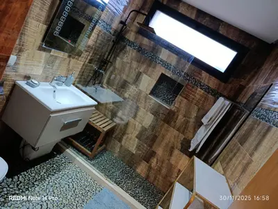 a bathroom with a toilet and a sink and a shower at Océane palm in Casablanca