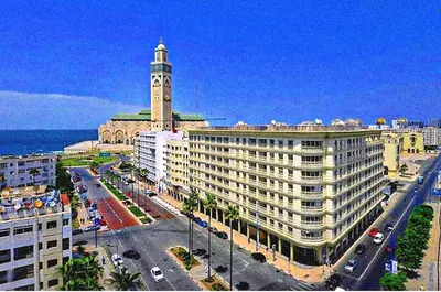 a large building with a clock tower on top of it at Bonheur Au bord de la mère in Casablanca