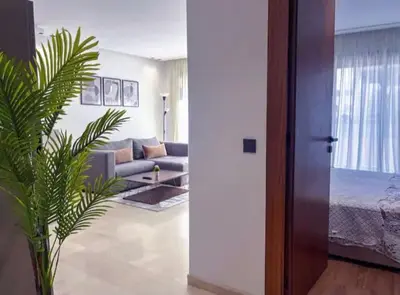 a living room with a couch and a bed at Sleek Modern Studio with Plenty of Light in Casablanca