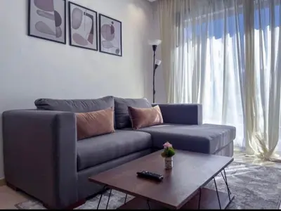 a living room with a couch and a coffee table at Sleek Modern Studio with Plenty of Light in Casablanca