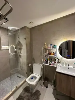 a bathroom with a toilet and a shower and a sink at High standing 2 bedroom apartment in Casablanca