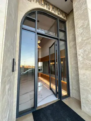 an entrance to a building with a large glass door at High standing 2 bedroom apartment in Casablanca