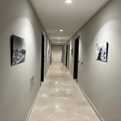 a hallway with two pictures on the walls at ORA Luxoria Suite Racine & Gym by Staycationcasa in Casablanca-Port