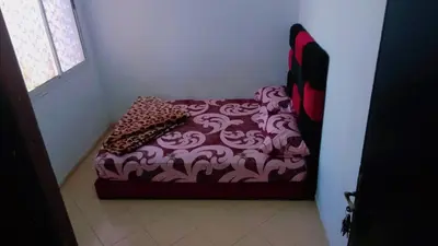 a bed sitting in a corner of a room at Bon repos in Casablanca