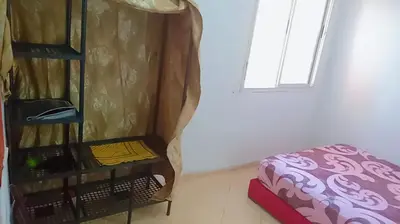 a room with a bed next to a door at Bon repos in Casablanca