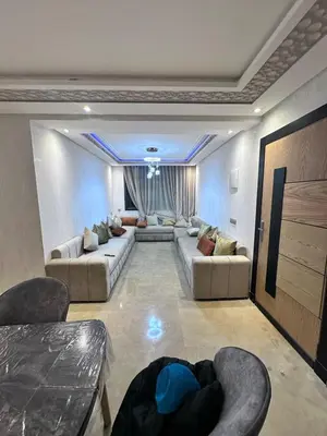 a large living room with couches and chairs in it at Résidence Macha'allah in O Ben Slimane