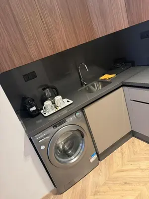 a washing machine in a kitchen next to a sink at Selena Modern Studio with Quick Access to Tramway near to Mohamed 5 Stadium in Casablanca in Casablanca