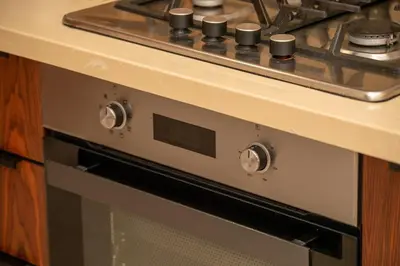 a stove top oven sitting under a kitchen counter at Peaceful Haven for a Quiet Stay in Maarif 500m to Mohamed Stadium in Casablanca