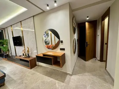 a living room with a table and a mirror at SALVia Loft - Sweetness and Cozy Apartment with Terrace Near Mohammed V Stadium in Casablanca