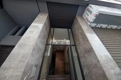 a lobby of a building with a glass door at SALVia Loft - Sweetness and Cozy Apartment with Terrace Near Mohammed V Stadium in Casablanca