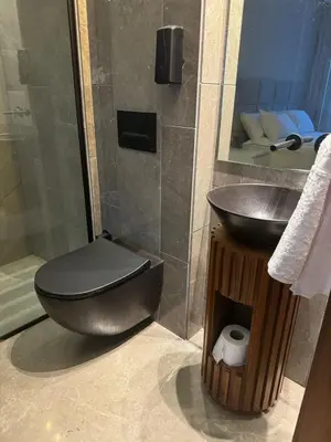 a bathroom with a toilet and a sink at HERBA Studio - Cozy Space with an Unobstructed View in Bourgogne in Casablanca