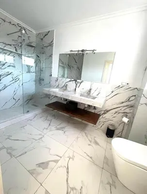 a bathroom with a sink and a mirror at Villa Sophia in Dar Bouazza
