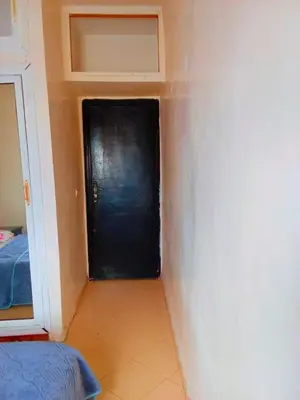 a black door in the corner of a room at Tranquilité au rendez-vous in Casablanca