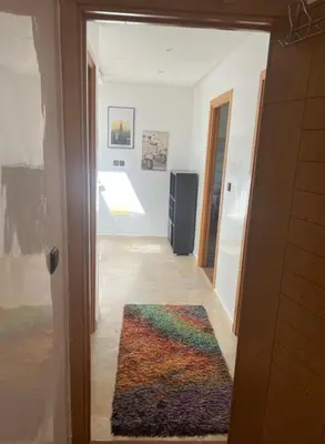 a room with a hallway with a rug on the floor at seaside entire villa with pool view in Casablanca