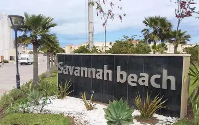 a sign for the savannah beach resort at seaside entire villa with pool view in Casablanca