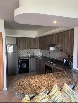 a kitchen with a granite counter top and a stove at seaside entire villa with pool view in Casablanca