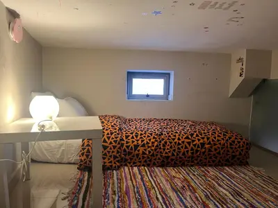 a bedroom with a bed and a window at Toute commodité in Casablanca
