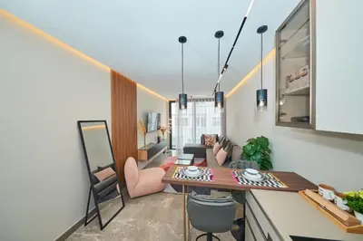 a kitchen and living room with a table and chairs at Marilla Studio - Elegant & Peaceful Stay in Bourgogne, Steps from Mohamed V Stadium in Casablanca
