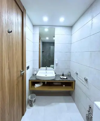 a bathroom with a sink and a mirror at Premium Studio Central Casablanca in Casablanca
