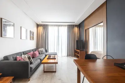 a living room with a couch and a table at APGCI-Elegant studio sur Ferme bretonne in Casablanca