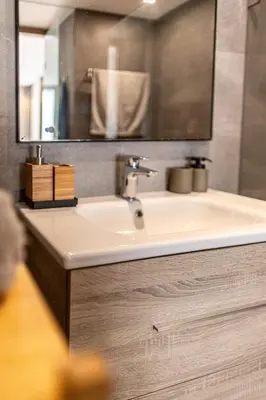 a bathroom with a sink and a mirror at APGCI-Elegant studio sur Ferme bretonne in Casablanca