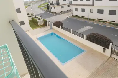 a swimming pool on the balcony of a apartment at Évasion Marine & piscine 3 chambres in Bouznika