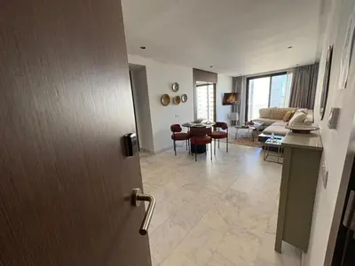 a room with a door open to a living room at Cosy Studio at B-Living Casa Port Ideal for Business & City Trips with Open View Heart Of Casablanca in Casablanca
