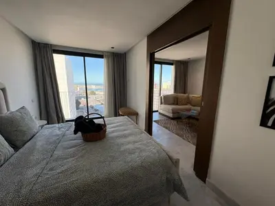 a bedroom with a bed with a basket on it at Cosy Studio at B-Living Casa Port Ideal for Business & City Trips with Open View Heart Of Casablanca in Casablanca