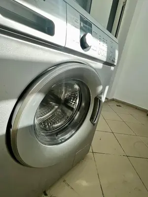 a washing machine with its door open in a room at Urban Chic 2BR - Prestigia near stadium in Rabat