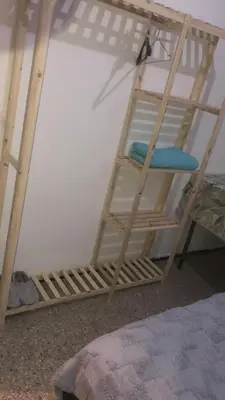a ladder on top of a bunk bed at Chambre cosy vue sur jardin in Mohammedia